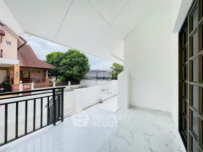 Spacious balcony with modern tiles and scenic neighborhood view