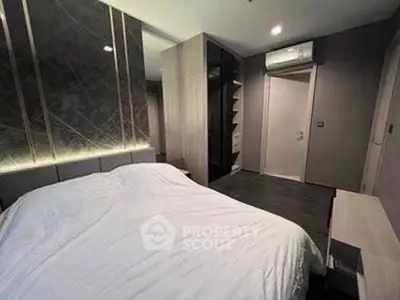 Modern bedroom with sleek design and ambient lighting