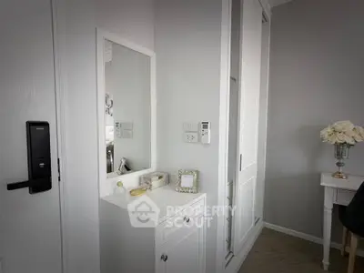Chic modern bedroom corner with elegant white furniture and decorative accents