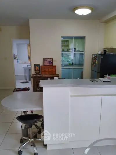 Spacious kitchen with modern appliances and open layout, perfect for culinary enthusiasts.