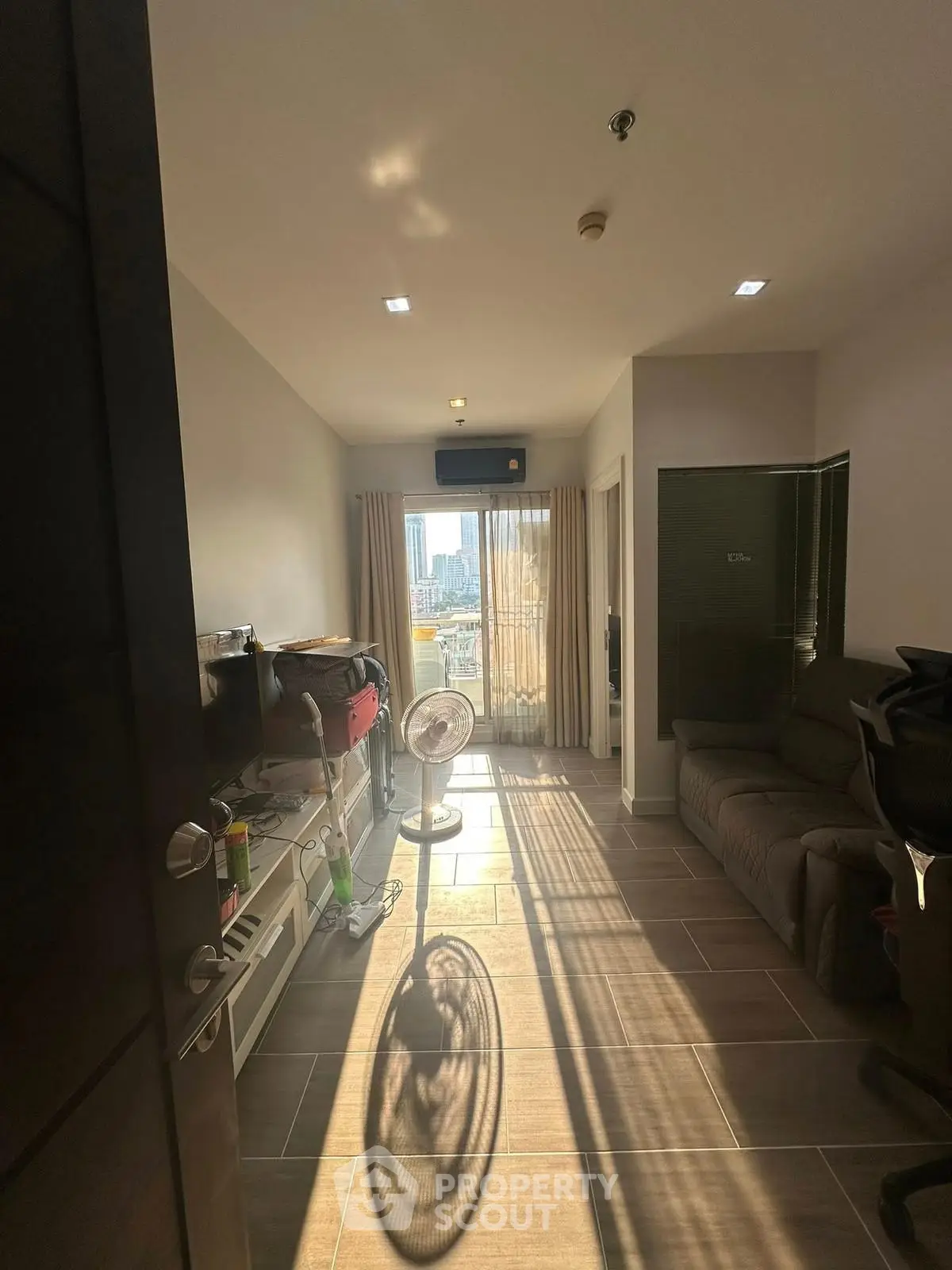 Cozy living room with city view and natural light