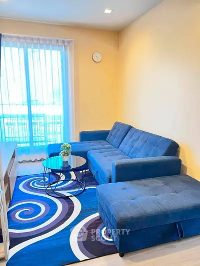 Stylish living room with blue sectional sofa and modern decor