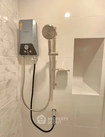 Modern bathroom shower with sleek design and built-in shelf, perfect for contemporary homes.