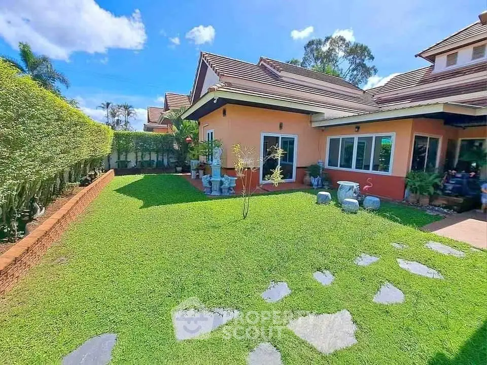 Charming suburban home with lush green garden and spacious outdoor area.
