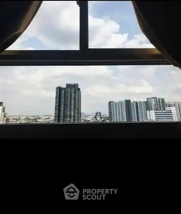 Stunning cityscape view from a high-rise window, perfect for urban living enthusiasts.