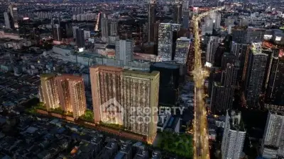 Stunning aerial view of illuminated high-rise buildings in bustling cityscape at night.
