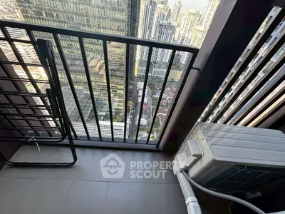 High-rise balcony with cityscape view and air conditioning unit