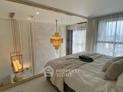 Luxurious bedroom with elegant chandelier and large window view