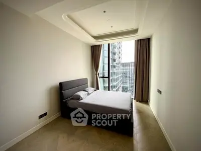 Modern bedroom with large window and city view in luxury apartment