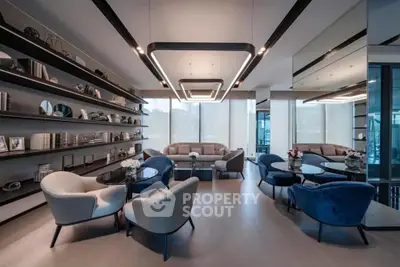 Luxurious open-plan living space with designer furniture, sleek lighting, and floor-to-ceiling windows offering ample natural light.