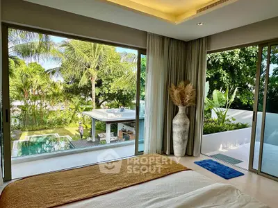 Luxurious bedroom with stunning pool and garden view, featuring floor-to-ceiling windows and elegant decor.