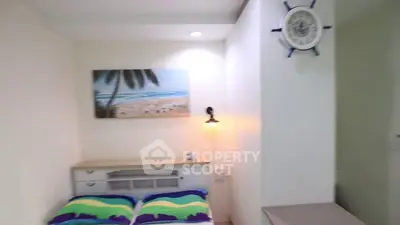 Cozy bedroom with beach-themed decor and vibrant bedding