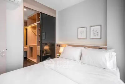 Modern bedroom with walk-in closet and elegant decor