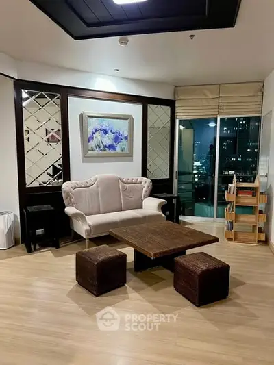 Stylish living room with elegant sofa and city view balcony in modern apartment.