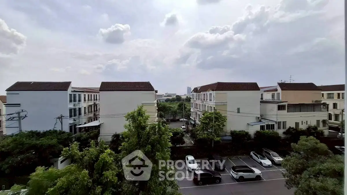 Charming suburban neighborhood with modern townhouses and lush greenery.
