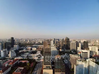 Stunning cityscape view showcasing modern skyscrapers and urban skyline under a clear blue sky.
