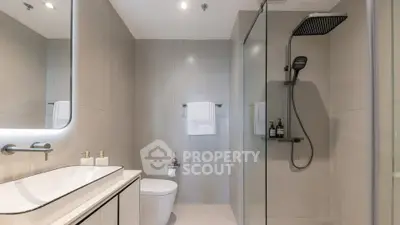 Modern bathroom with sleek design and glass shower enclosure