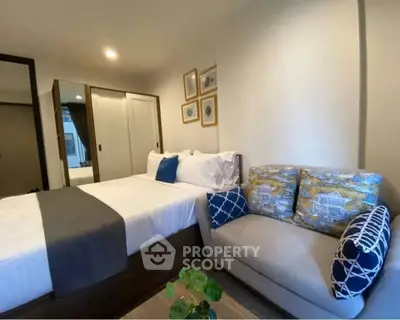 Cozy bedroom with stylish decor and comfortable seating area