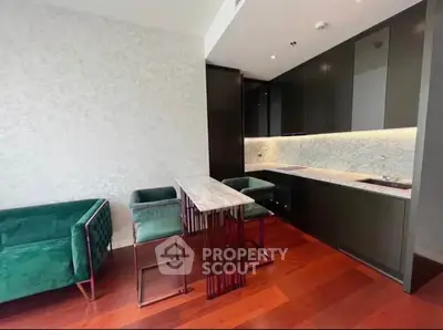 Luxurious modern kitchen with sleek design and elegant green seating, perfect for stylish living.