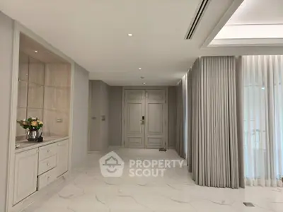Elegant modern interior with marble flooring and stylish curtains in a spacious room
