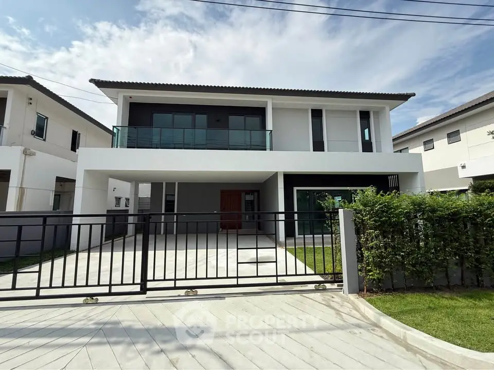 Modern two-story house with sleek design and spacious driveway