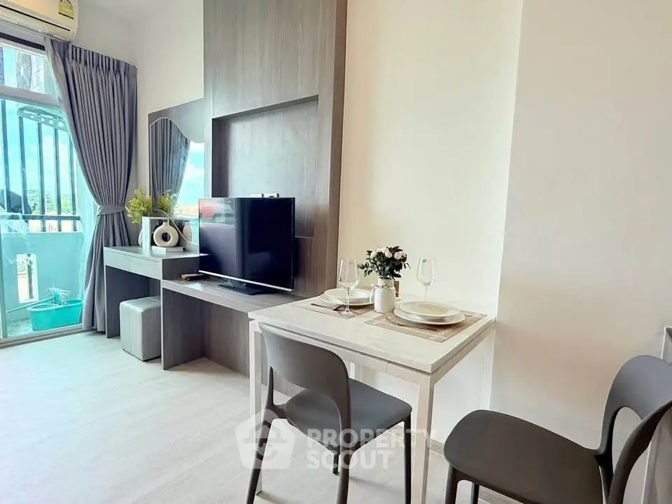 Modern living room with balcony view and stylish dining area