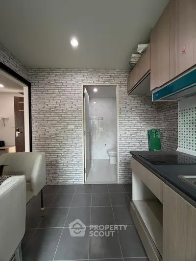 Modern compact kitchen with open layout and sleek cabinetry