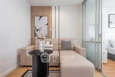 Modern living room with stylish decor and cozy beige sofa in a contemporary apartment.