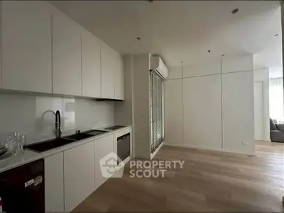 Modern kitchen with sleek cabinetry and built-in appliances in a minimalist design.