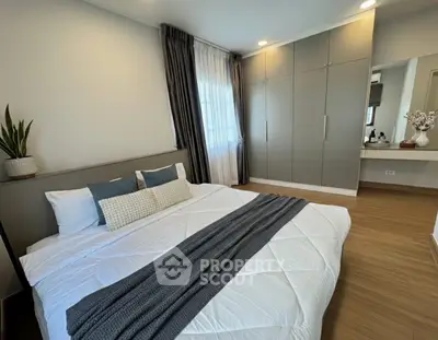 Modern bedroom with stylish decor and ample storage space