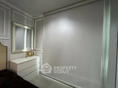 Elegant bedroom corner with modern dresser and mirror