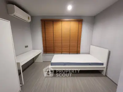 Modern minimalist bedroom with sleek design and natural light