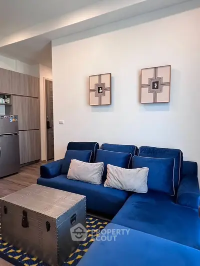 Stylish living room with blue sofa and modern decor