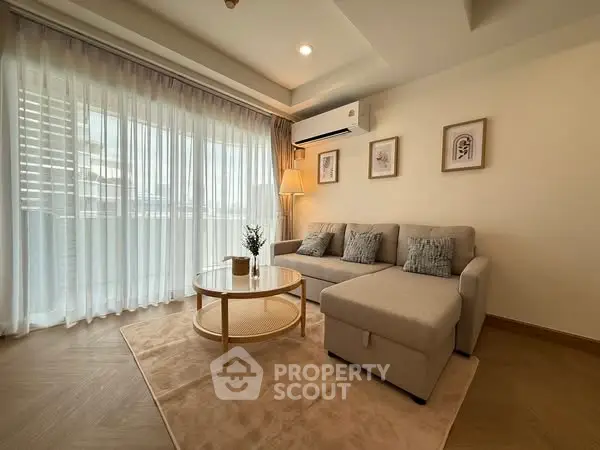 Elegant living room with cozy sofa and natural light