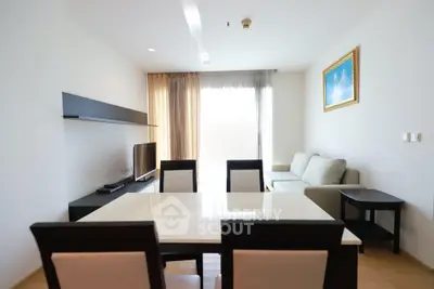Modern living room with sleek furniture and natural light, perfect for relaxation and entertainment.