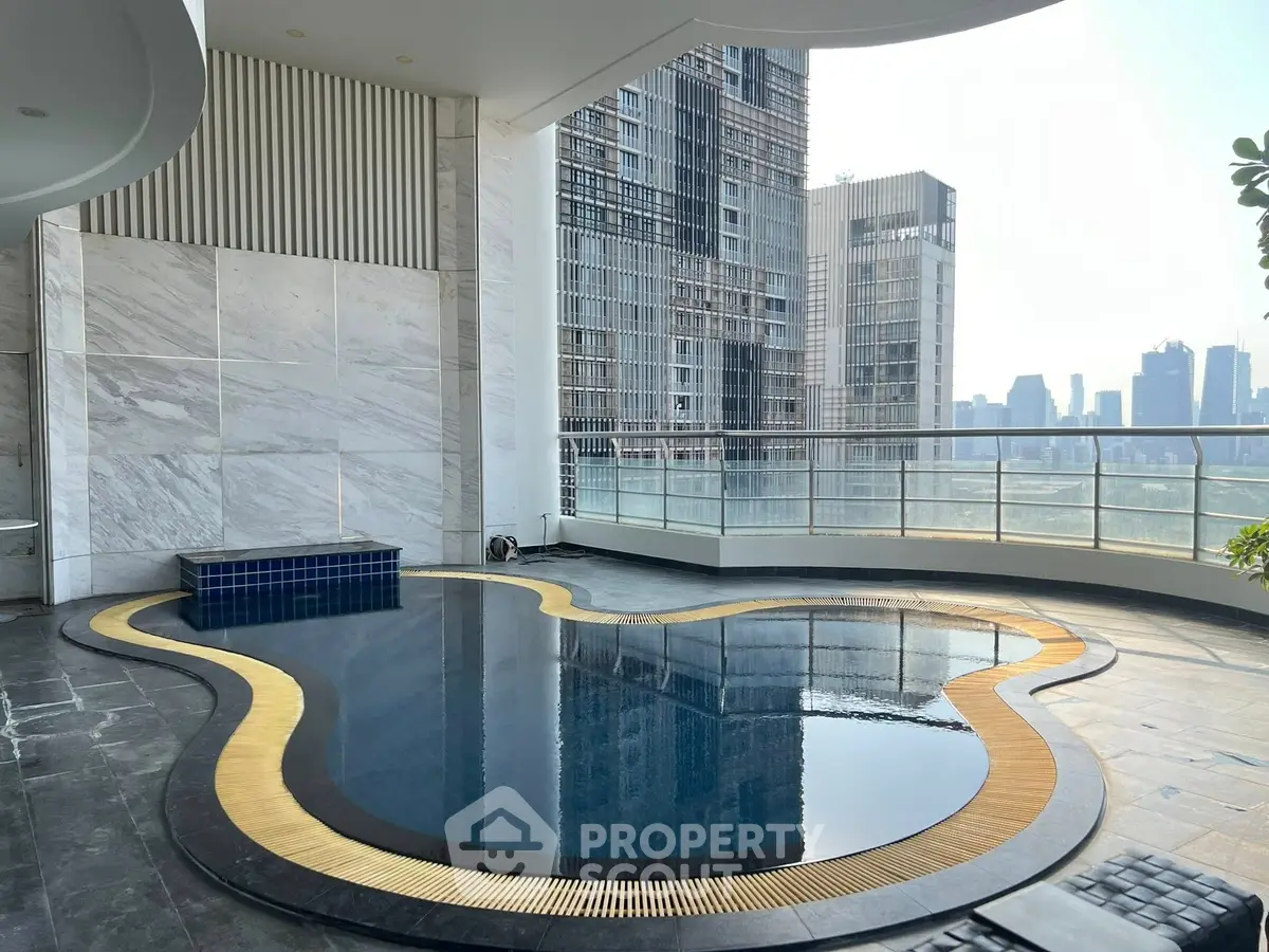 Luxurious rooftop pool with stunning city skyline view in modern high-rise building.