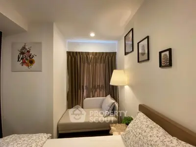 Cozy bedroom with modern decor and soft lighting, featuring a comfortable bed and stylish wall art.