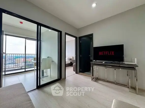 Modern living room with balcony view and sleek interior design.