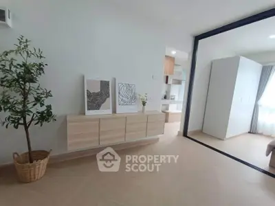 Modern minimalist interior with light wood accents and natural light