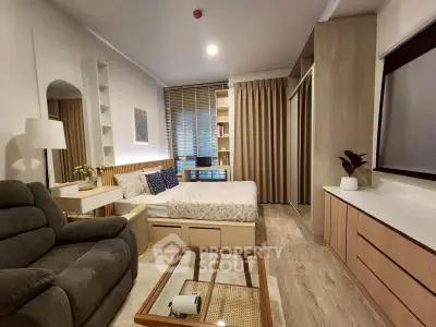 Modern studio apartment with cozy living area and stylish decor
