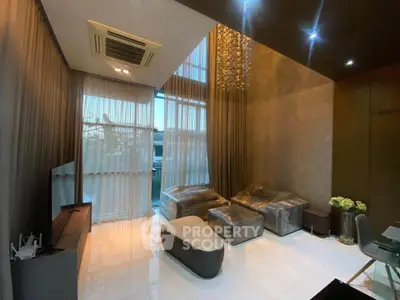 Luxurious modern living room with high ceilings and elegant decor