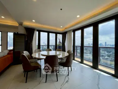 Luxurious dining area with panoramic city views and elegant furnishings