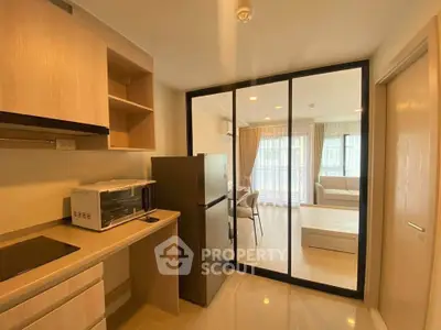 Modern kitchen with open layout and sleek appliances in a bright apartment