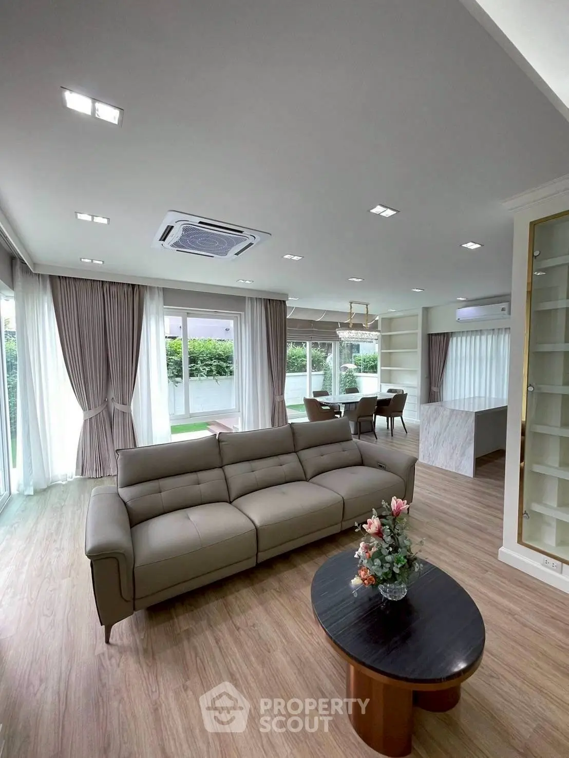Spacious modern living room with elegant decor and garden view