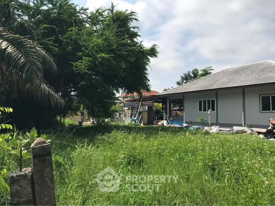 Charming suburban home with lush greenery and spacious yard, perfect for nature lovers seeking tranquility.