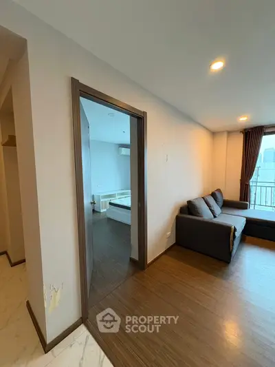 Modern apartment interior with cozy living room and bedroom view