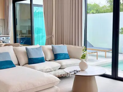 Luxurious living room with pool view and elegant decor