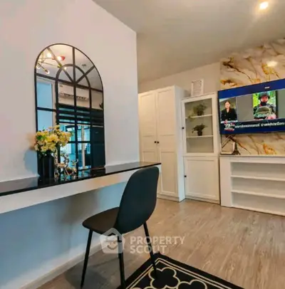 Stylish living room with modern decor and wall-mounted TV