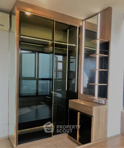 Modern bedroom with sleek built-in wardrobe and city view window