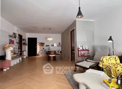 Spacious modern living room with stylish decor and wooden flooring
